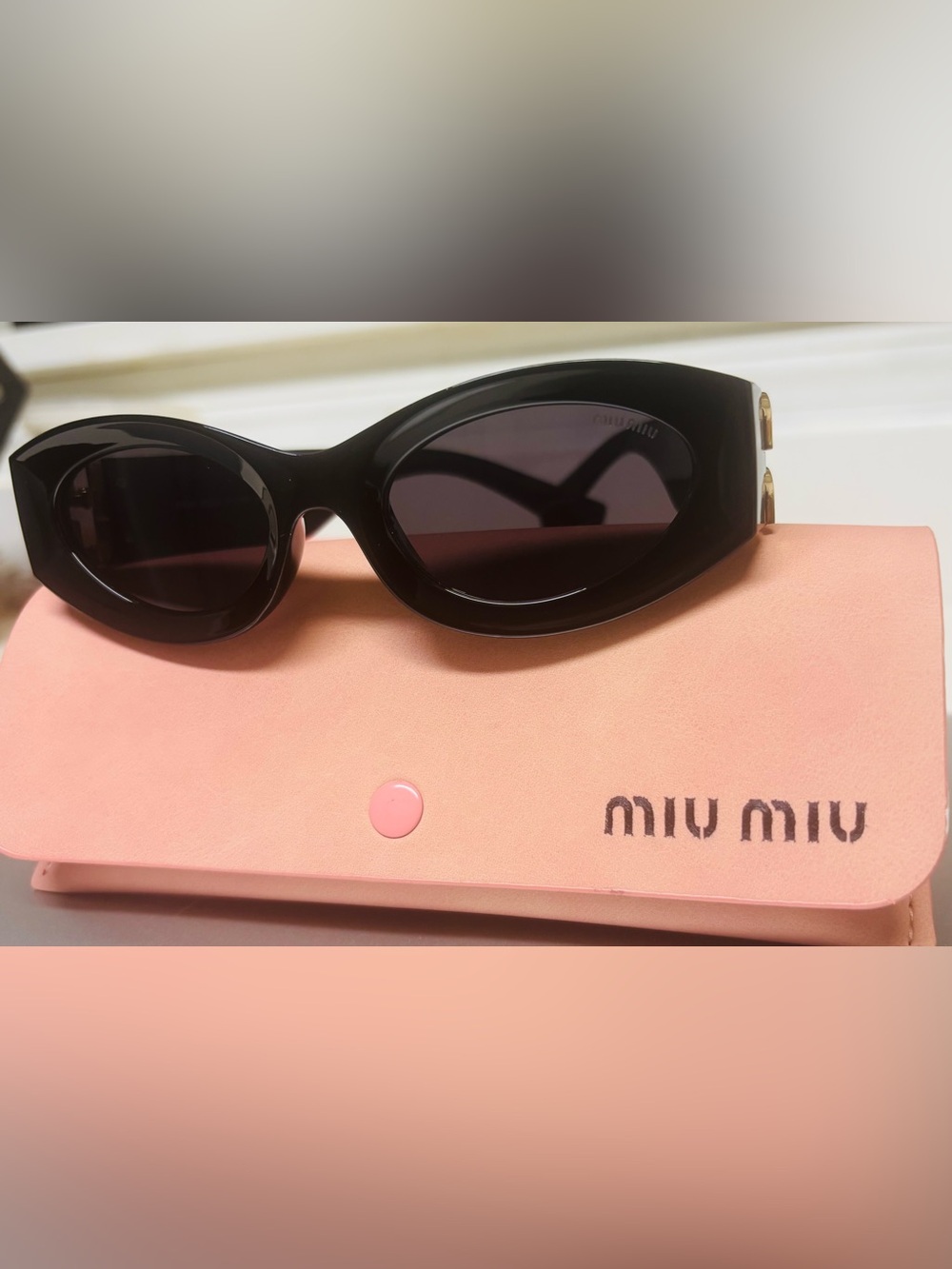 Miu Miu Black Oval Sunglasses with Gold Accent - Picture 7 of 7